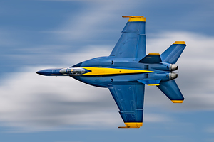 US Navy F-18 Super Hornet of the Blue Angels races across the sky