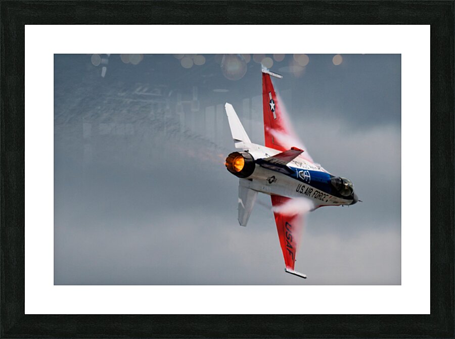 A United States Air Force F-16 Viper races across the sky afterburner ablaze Picture Frame print